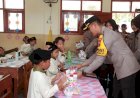 Jumat-Berkah,-Polres-Jember-Berbagi-Makanan-Bergizi-Untuk-Pelajar-Sekolah-Dasar